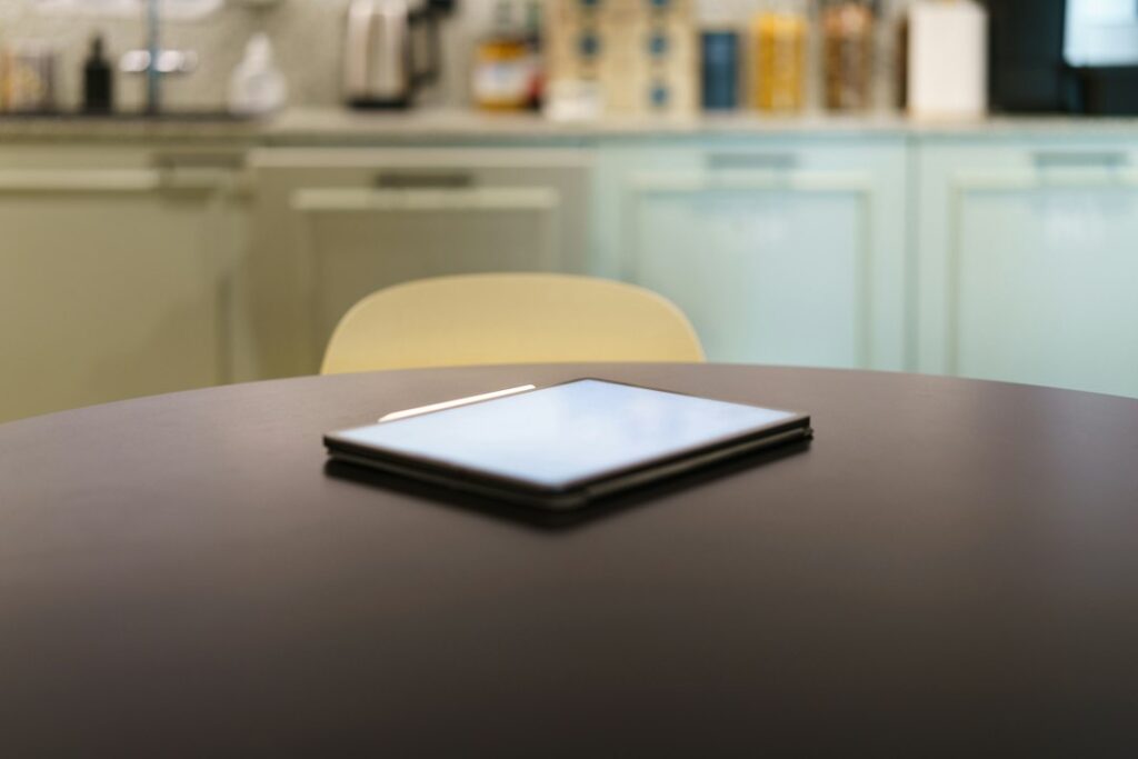 Tablet used for reading on a table, illustrating ebook and audiobook use