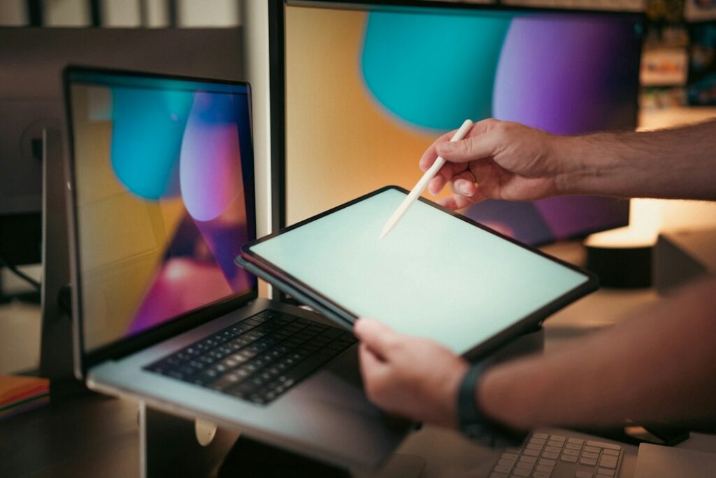 Person using a stylus on a tablet, illustrating note-taking and keyboard alternatives