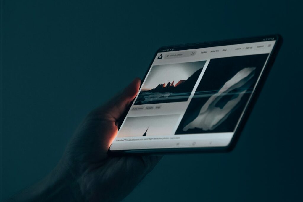 Person holding a tablet, illustrative photo for Alexa Tablet versus Fire Tablet upgrade guide